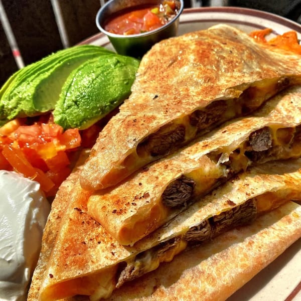Eat'n Park's steak quesadilla with melted cheese, avocado, diced tomatoes, sour cream, and salsa.