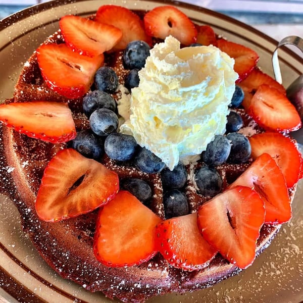 Eat'n Park's chocolate waffle topped with fresh strawberries, blueberries, and whipped cream.