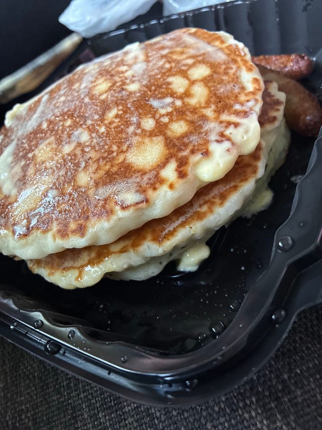 3 Buttermilk Pancakes with Bacon or Sausage.